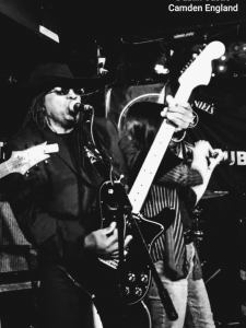 Black and white still of Dee performing at Dublin Castle in Camden England